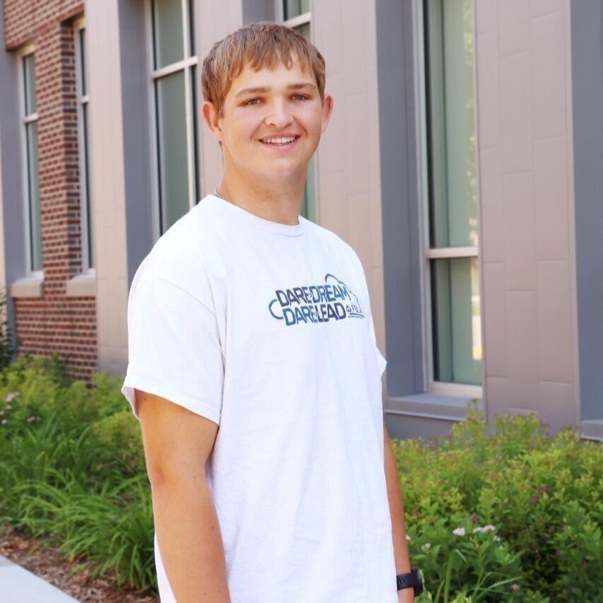 Feamle MSU hockey player in action on the ice